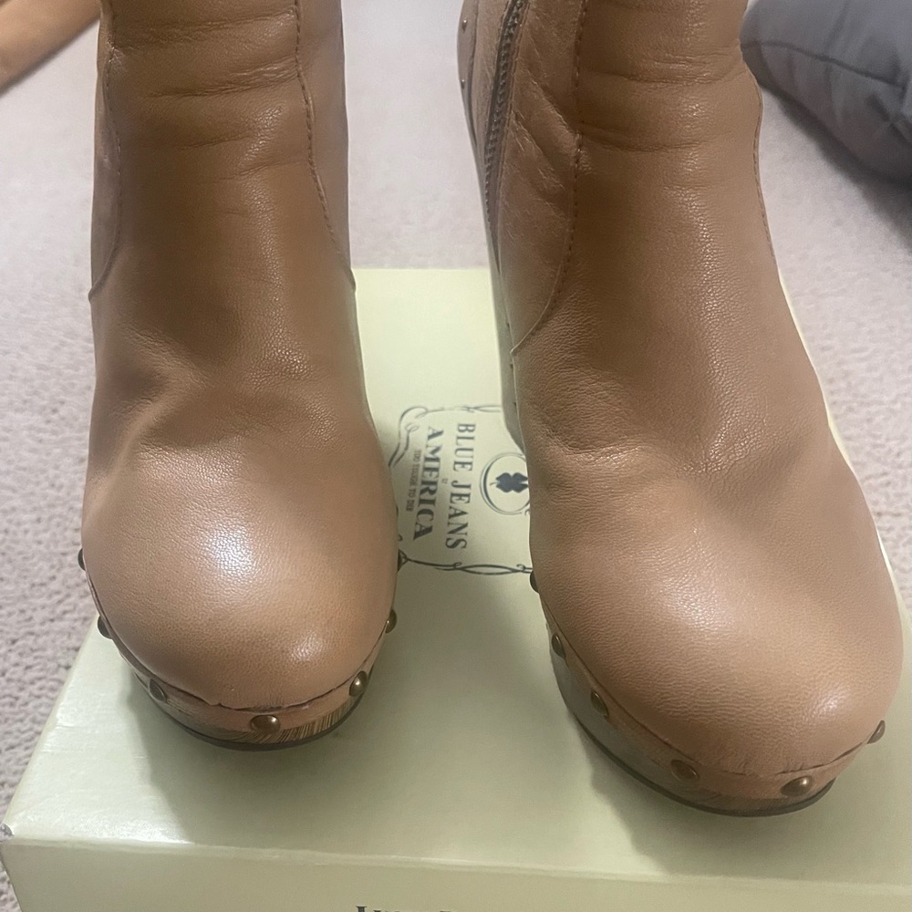 Platform wooden heel and studded boots.